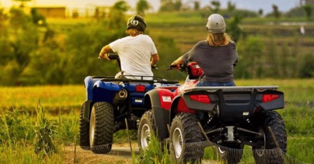 Visitors riding quad bikes through the Zanzibar countryside on a guided ATV adventure tour with local villages and tropical scenery.