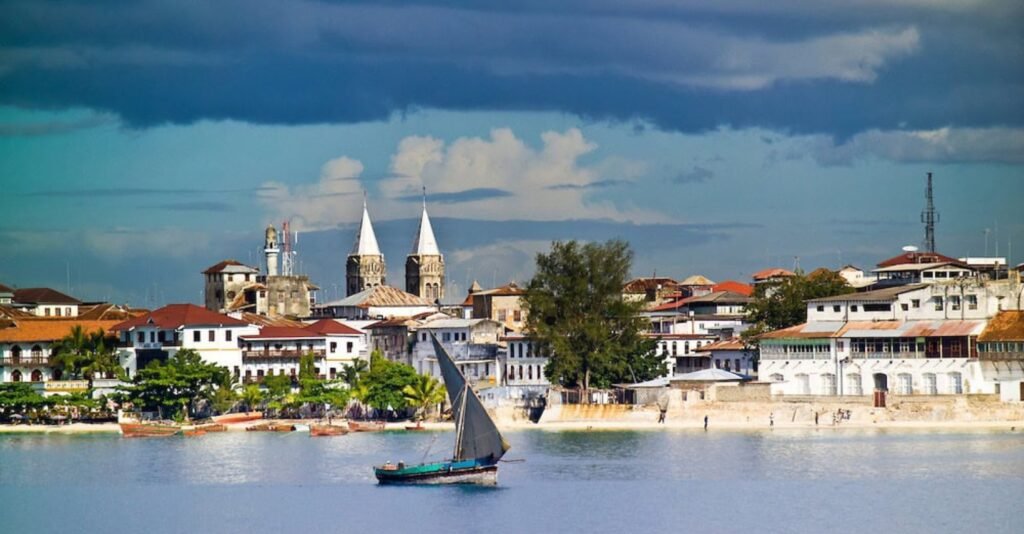 Visitors exploring the historic streets of Stone Town Zanzibar during a guided UNESCO World Heritage city walking tour.